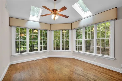 a living room with furniture a window and a table
