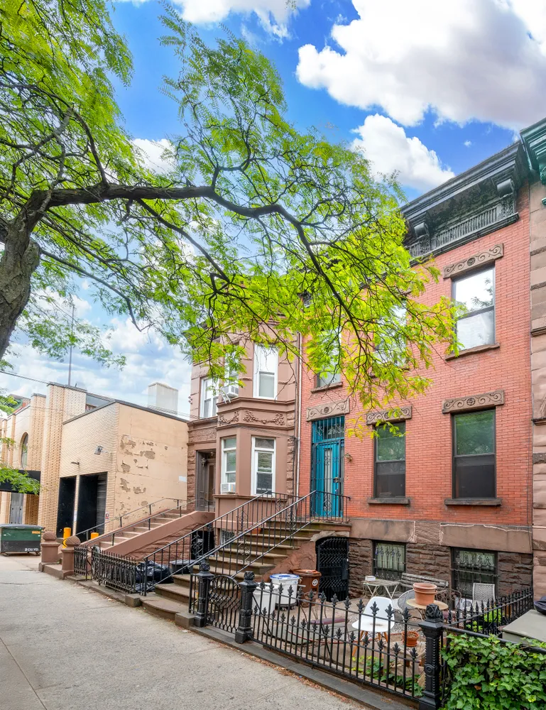 a front view of a house with yard