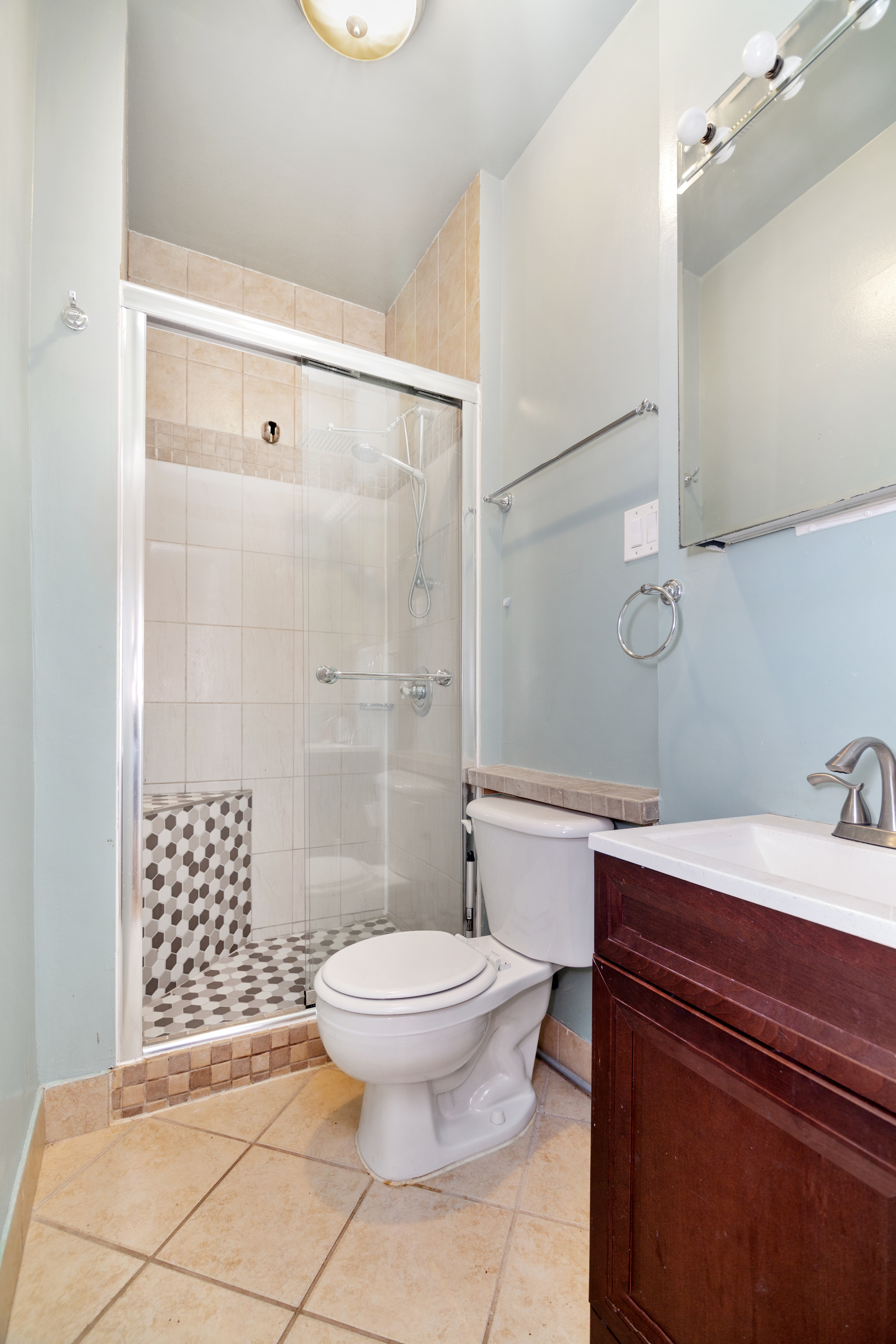 200 West 109th Street, Unit 2 Manhattan, NY 10025 - Photo 6 of 6 a bathroom with a sink toilet and shower