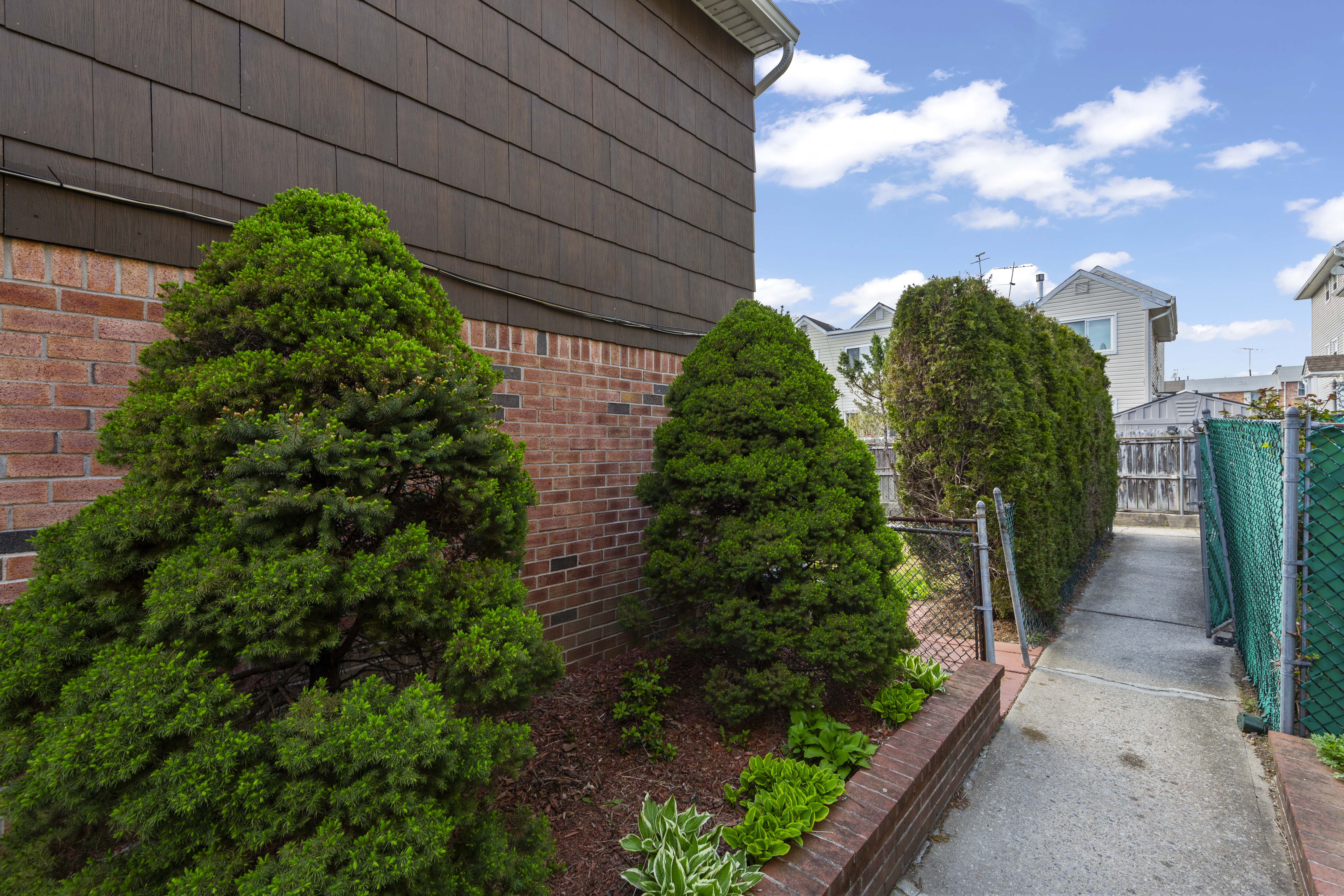 240-47 68th Avenue Queens, NY 11362 - Photo 38 of 39 a view of a garden