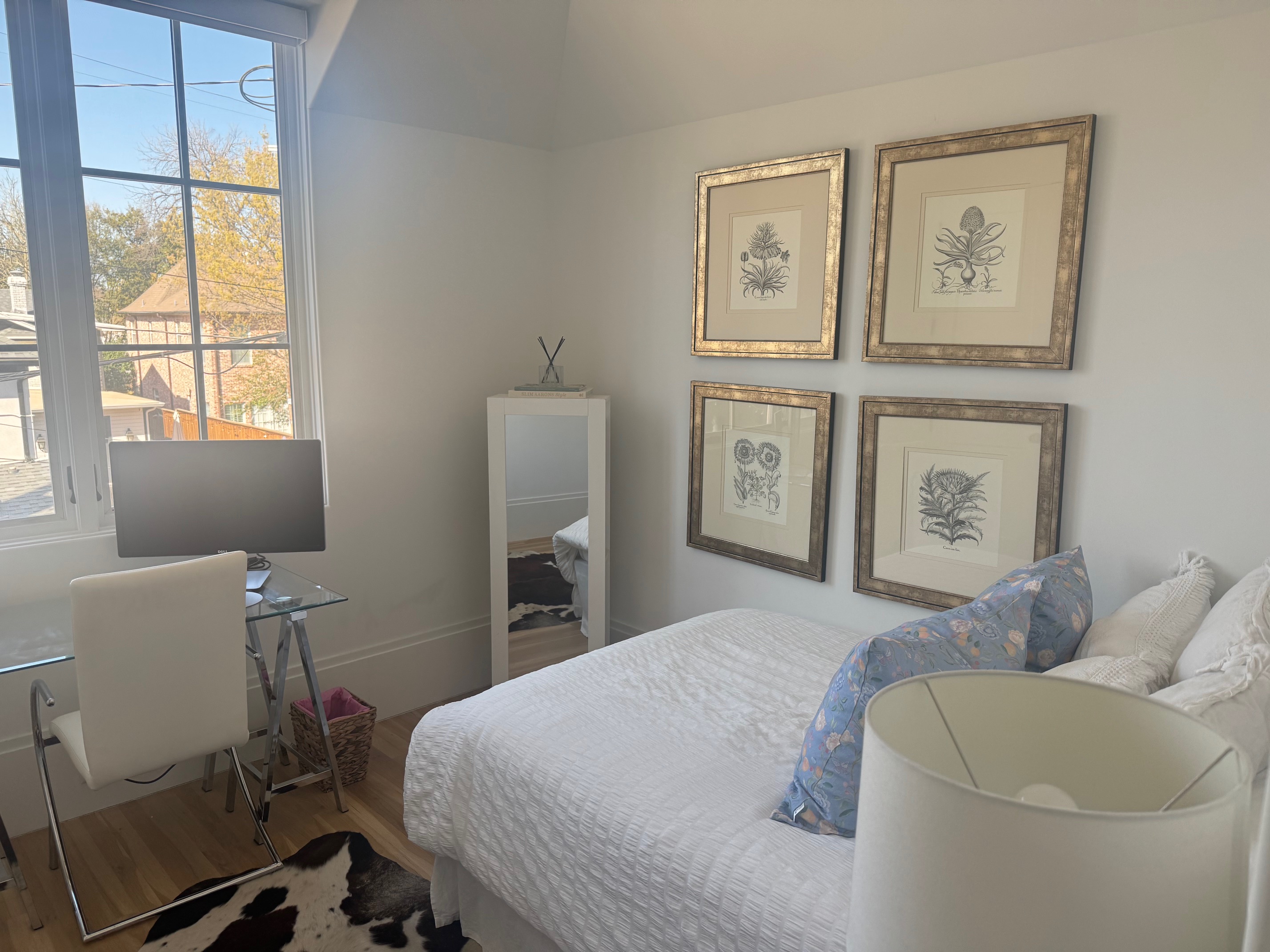 Address Upon Request Dallas, TX 75219 - Photo 5 of 12 a bedroom with a bed and chair with window