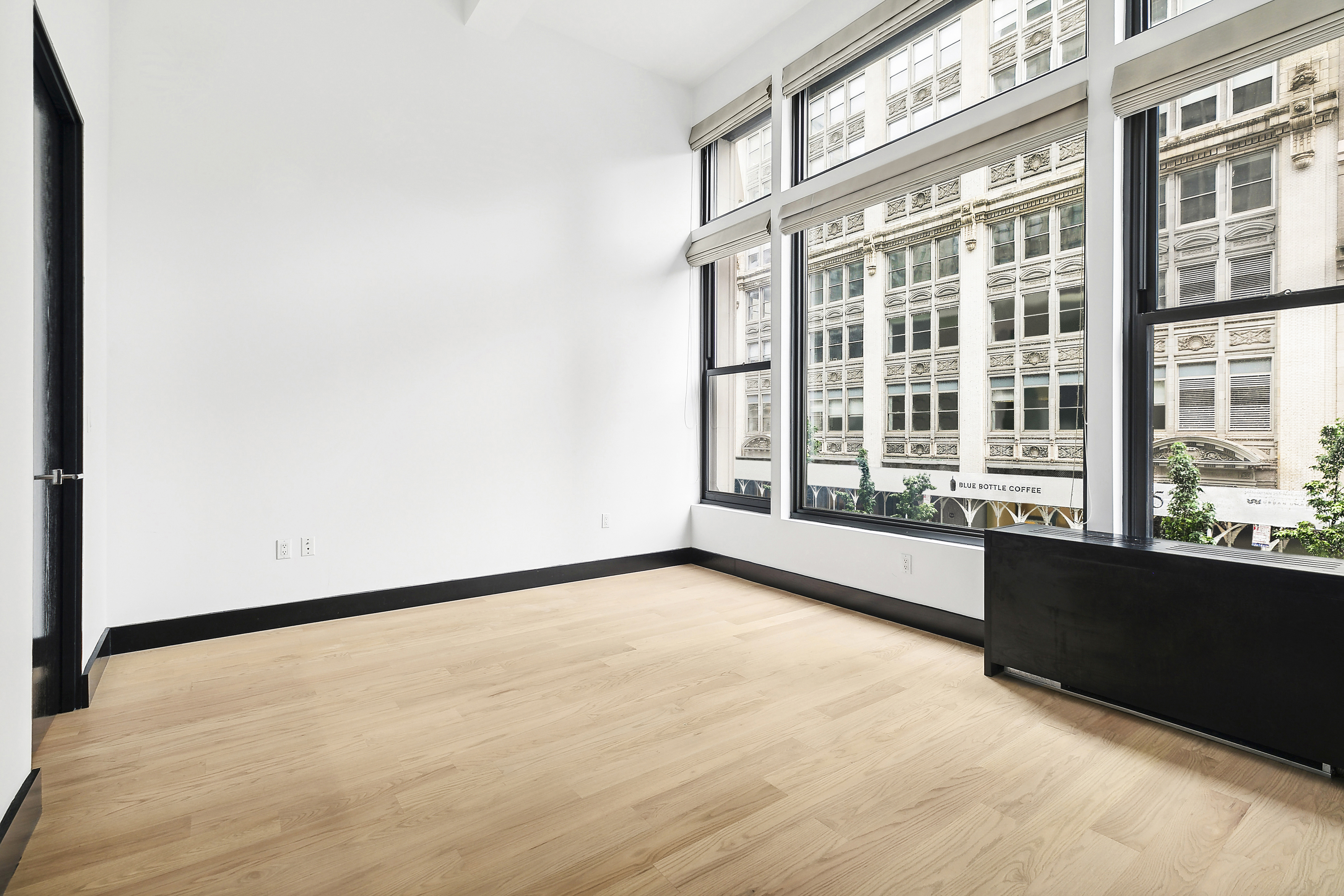 254 Park Avenue South, Unit 3C Manhattan, NY 10010 - Photo 6 of 9 a view of an empty room with a window