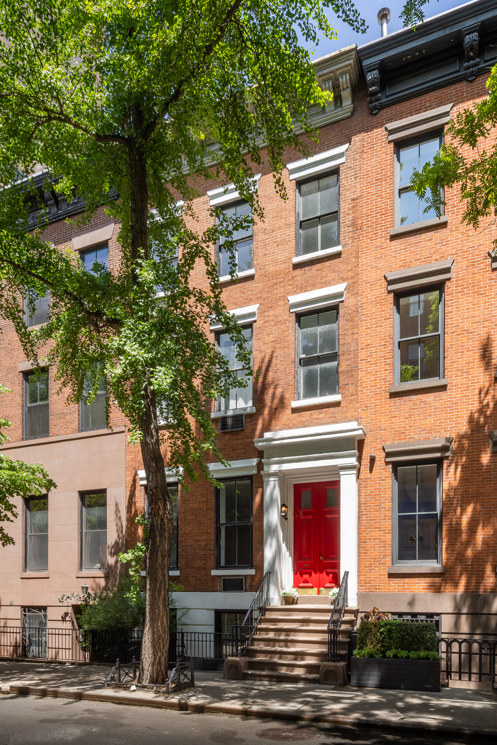 a view of a building with a tree