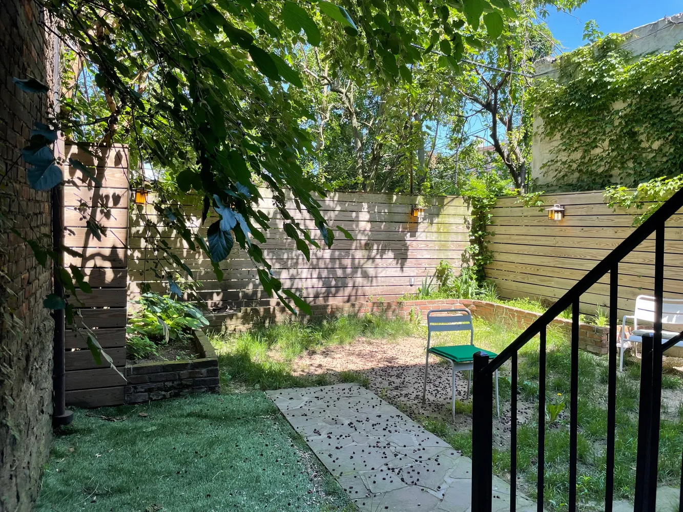 a view of a house with a tree in a yard