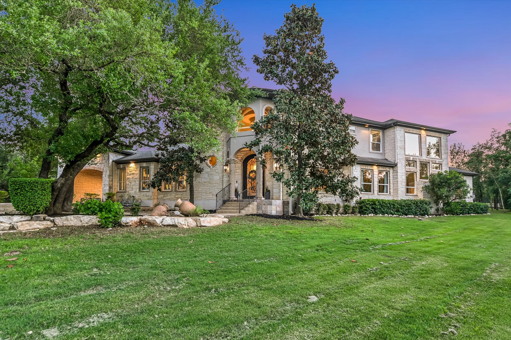 1422 Palomino Ridge Drive Austin, TX 78733 - Photo 1 of 60 a front view of a house with a yard
