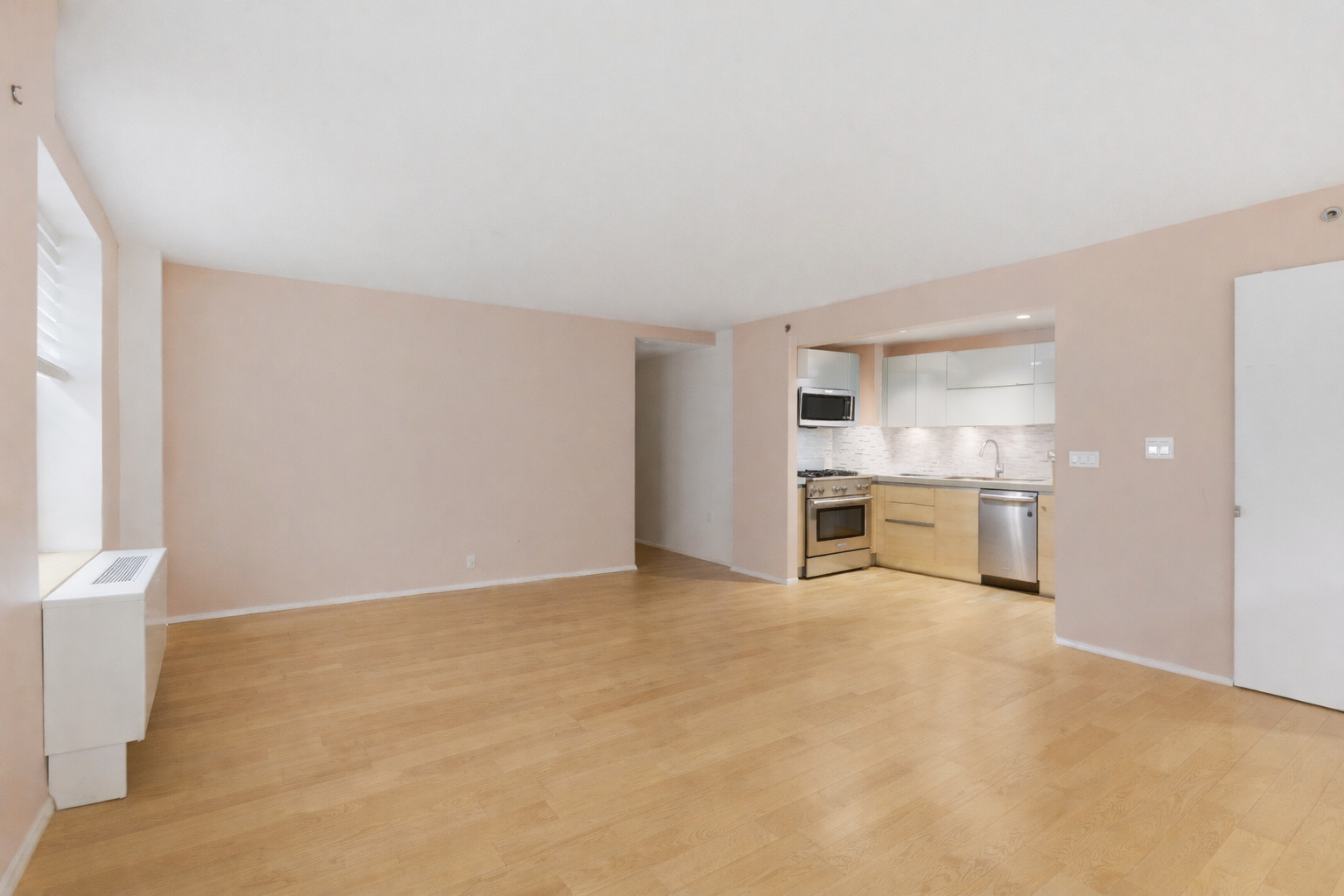 2280 Frederick Douglass Boulevard Manhattan, NY 10027 - Photo 5 of 10 a view of a kitchen with a sink and a refrigerator