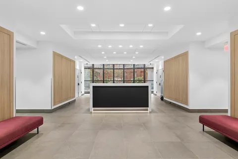 a view of kitchen with refrigerator and window