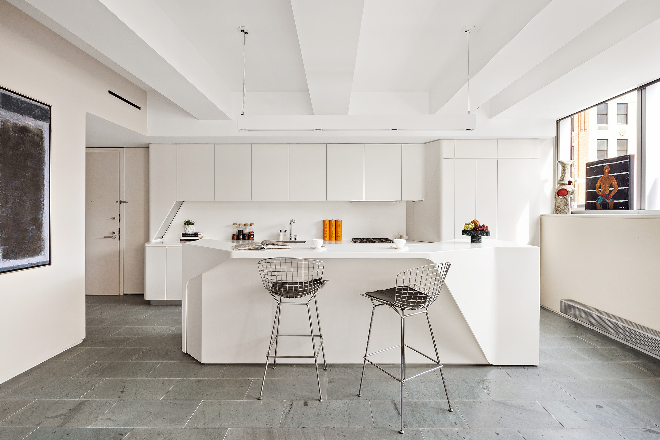 166 Perry Street, Unit 4B Manhattan, NY 10014 - Photo 4 of 14 a kitchen with a sink a stove cabinets and a window