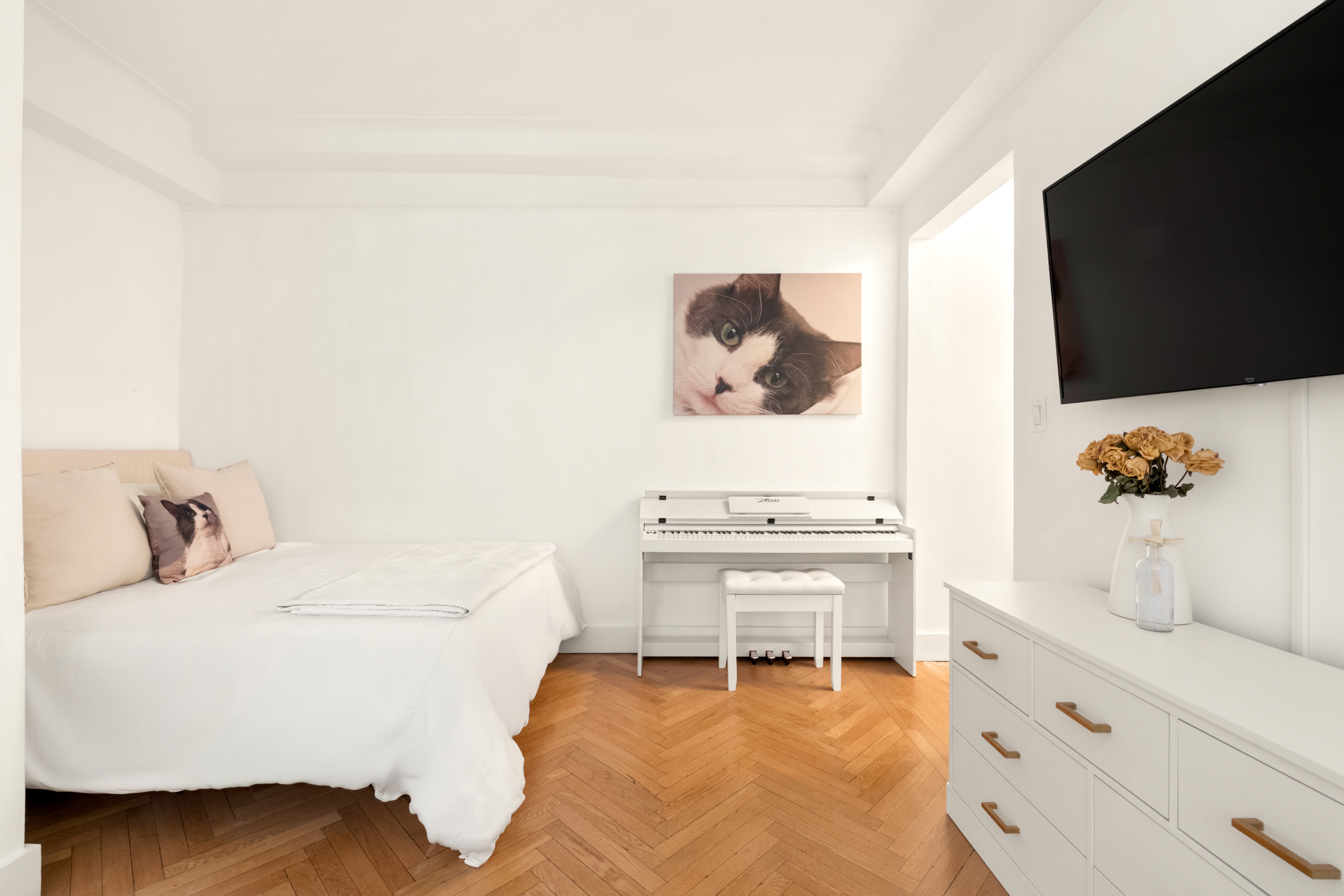 33 Riverside Drive, Unit 4D Manhattan, NY 10023 - Photo 2 of 9 a living room with furniture and a flat screen tv