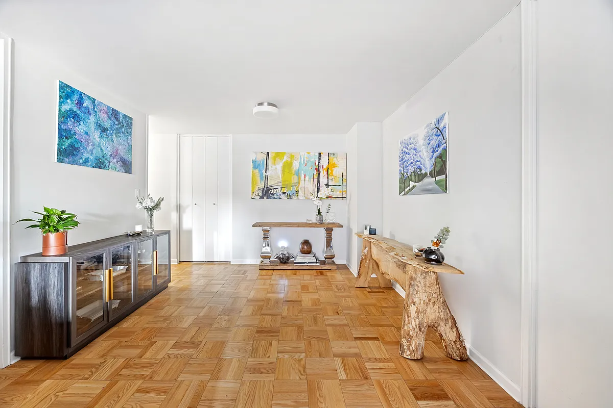 300 East 40th Street, Unit 3J Manhattan, NY 10016 - Photo 4 of 8 a bed room with a bed and a couch