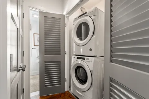 a view of a hallway with washer and dryer