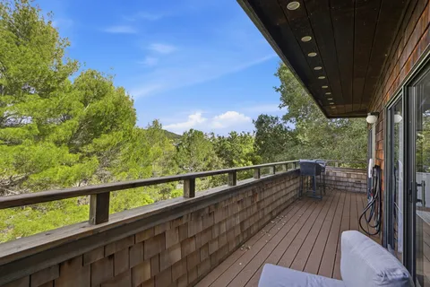 a view of balcony with furniture