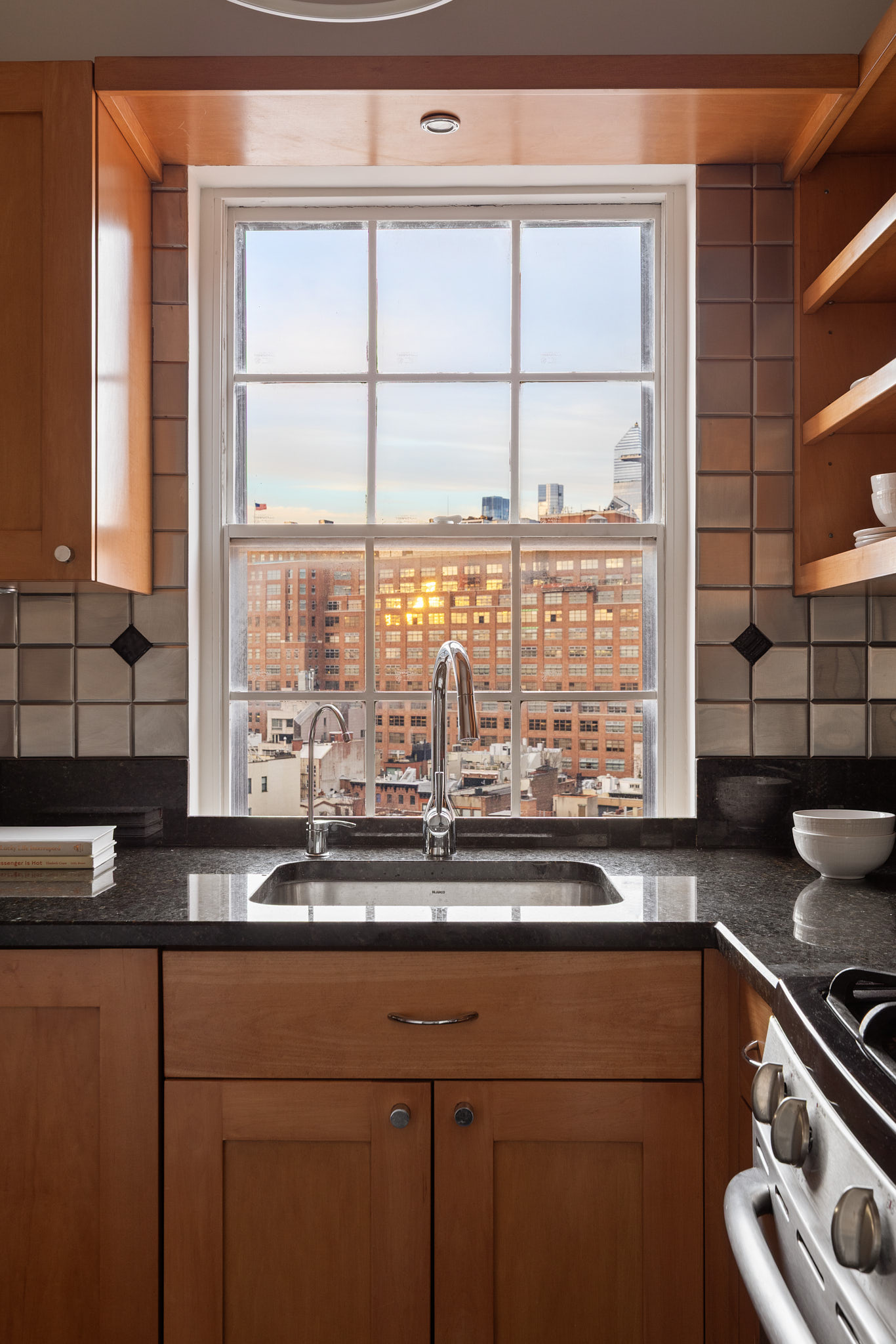 31 Jane Street, Unit 16G Manhattan, NY 10014 - Photo 11 of 20 a kitchen with a sink and a window