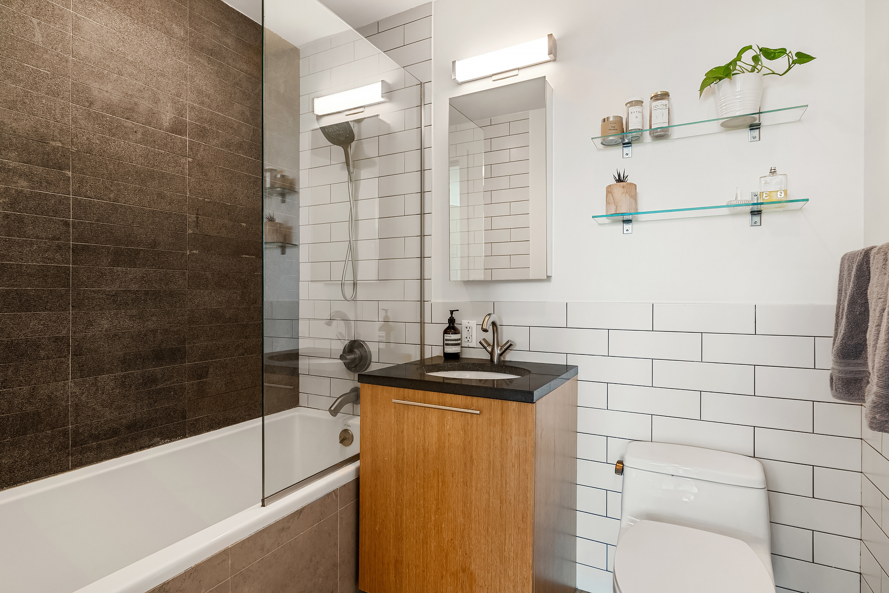 1 Powers Street, Unit 404 Brooklyn, NY 11211 - Photo 6 of 14 a bathroom with a sink and a bathtub