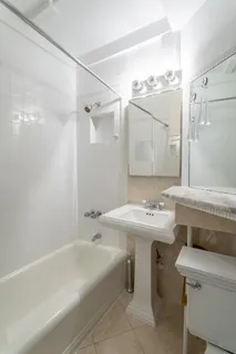 a bathroom with a sink and mirror