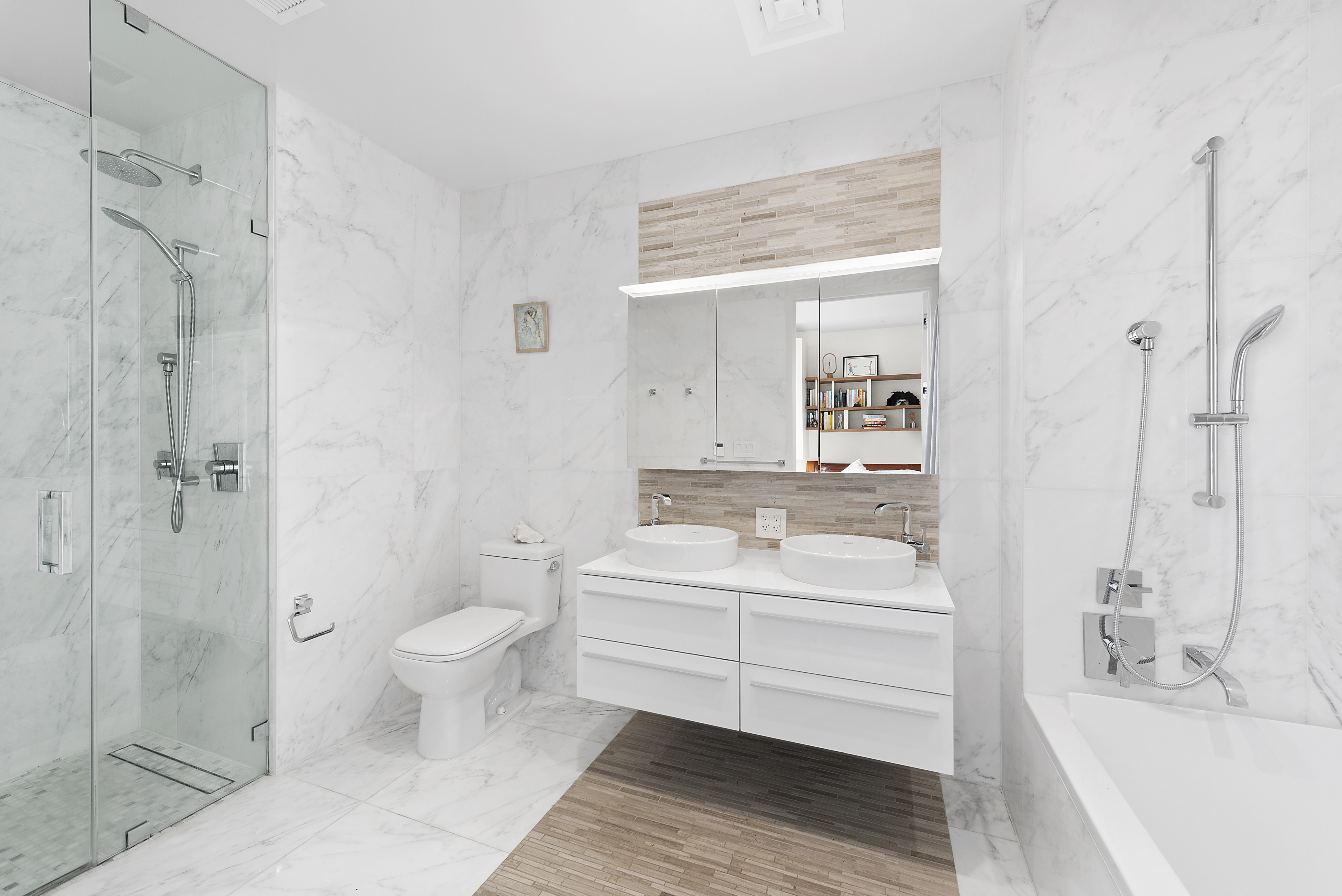 285 West 110th Street, Unit 9B Manhattan, NY 10026 - Photo 7 of 20 a bathroom with a bathtub shower sink mirror and toilet