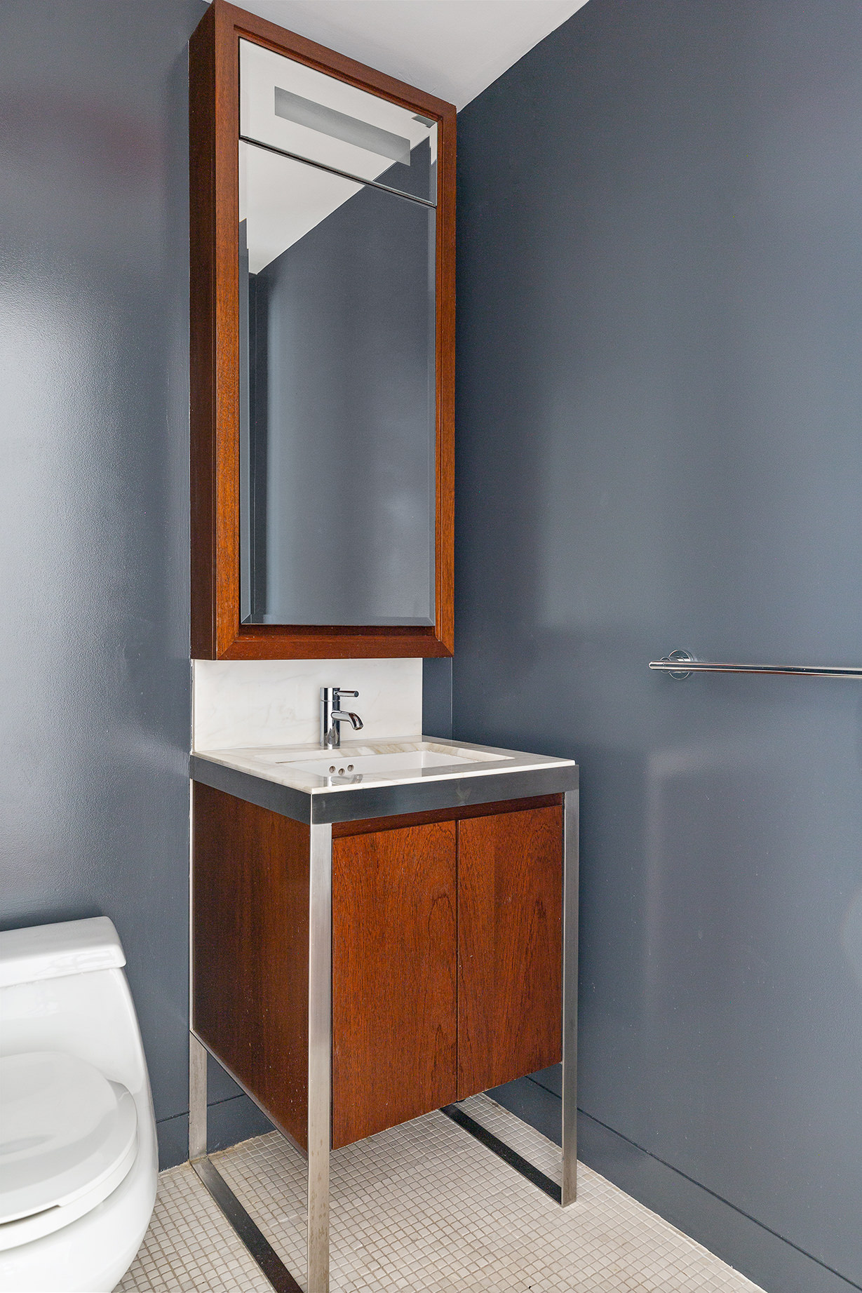 225 Lafayette Street, Unit 10D Manhattan, NY 10012 - Photo 9 of 14 a bathroom with a sink and a toilet
