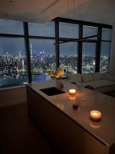 45-3 Ct Square West, Unit PH202 Queens, NY 11101 - Photo 9 of 12 a view of a floor to ceiling window and wooden floor