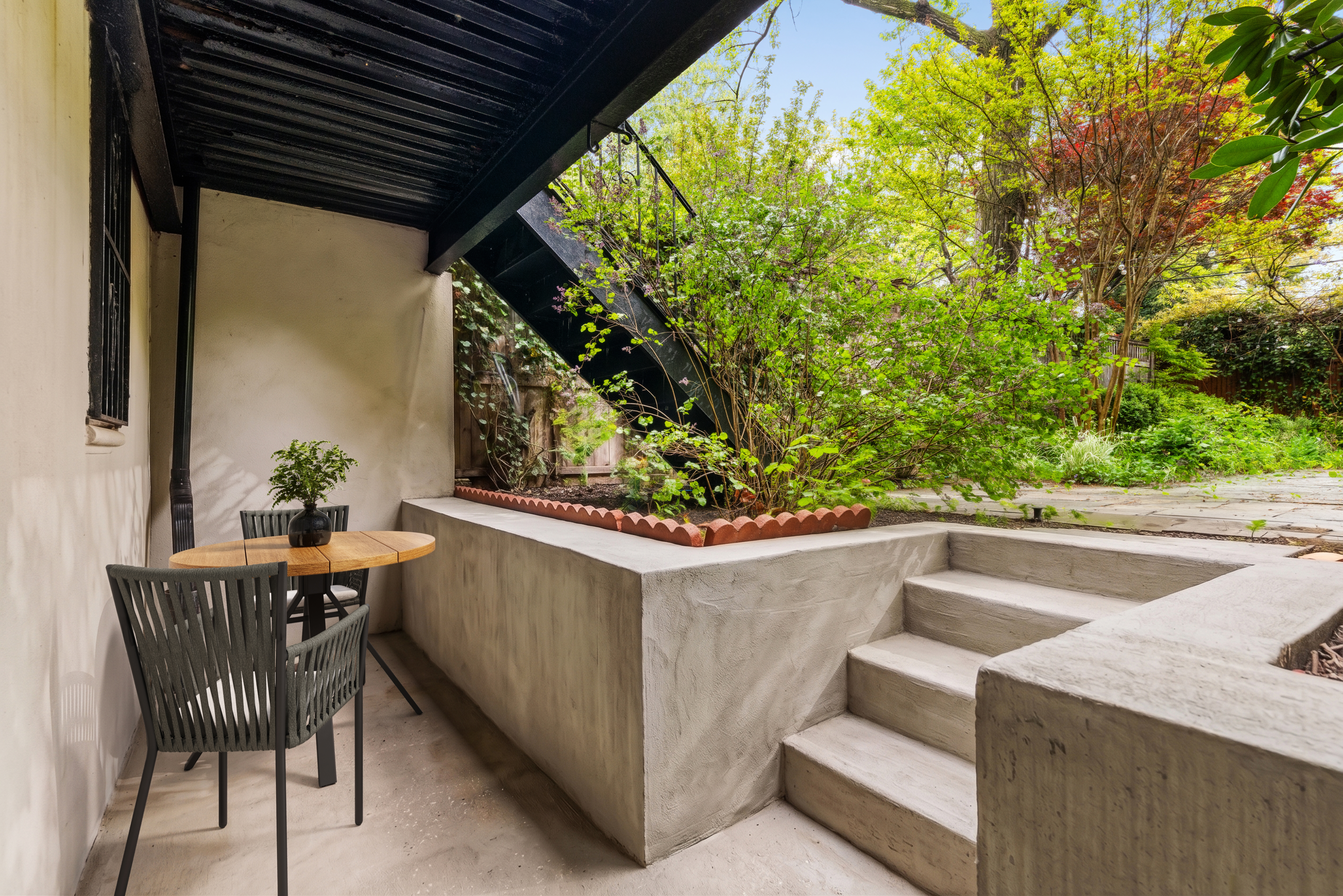 341 Adelphi Street, Unit 1 Brooklyn, NY 11238 - Photo 4 of 7 a view of a patio with table and chairs and potted plants