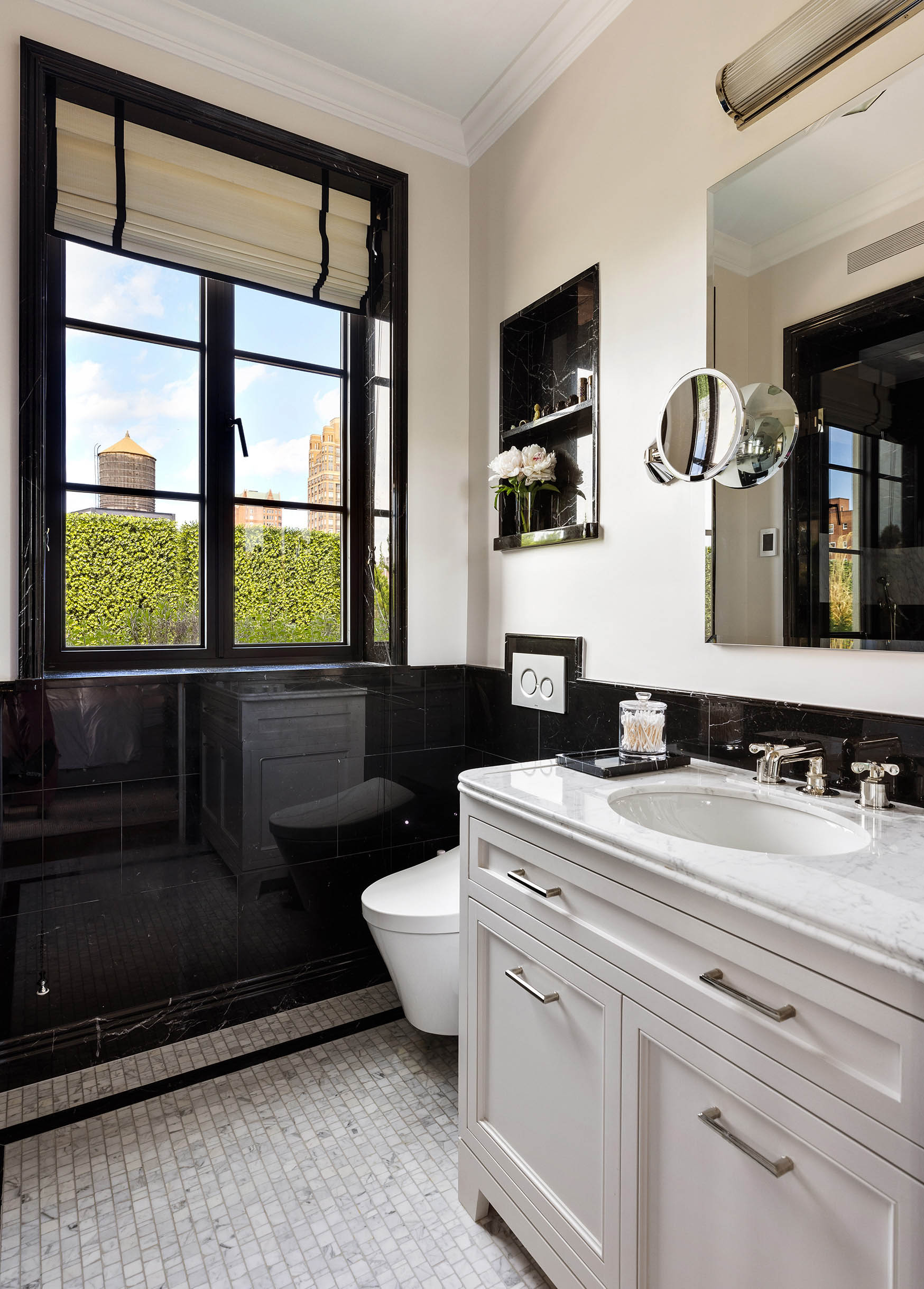150 East 73rd Street, Unit PH Manhattan, NY 10021 - Photo 17 of 29 a bathroom with a sink a toilet and mirror
