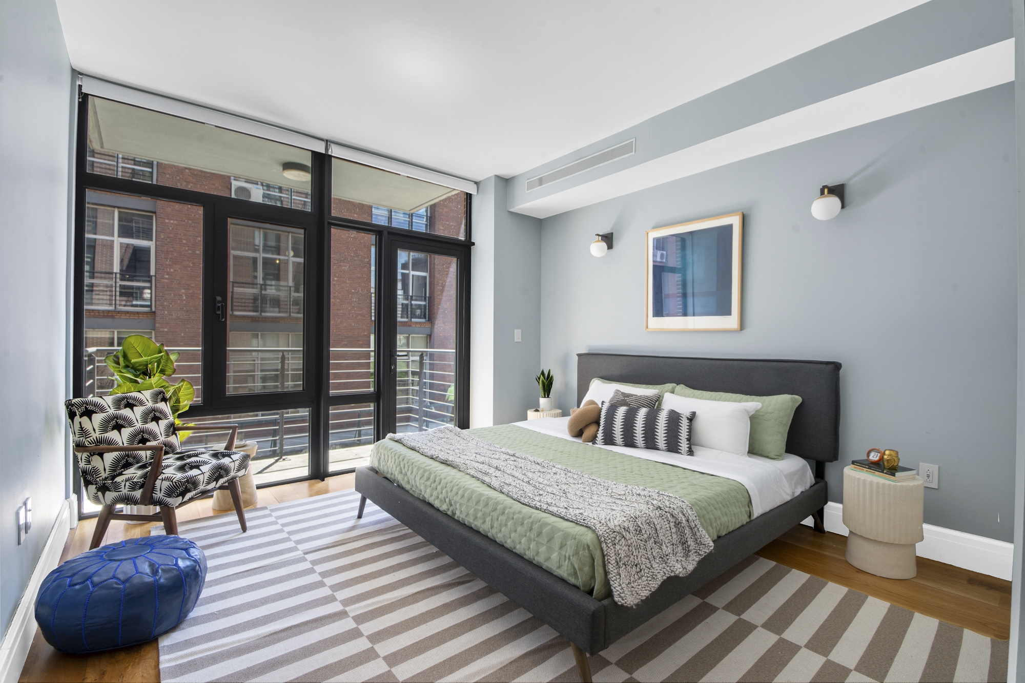 47 Bridge Street, Unit 3DD Brooklyn, NY 11201 - Photo 8 of 24 a bedroom with a large bed and a potted plant