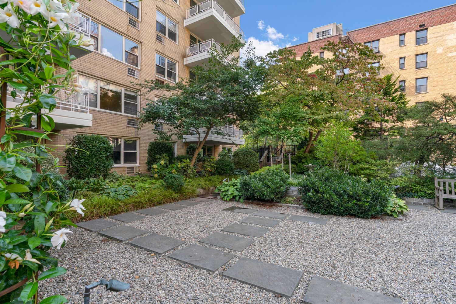 40 East 9th Street, Unit 6M Manhattan, NY 10003 - Photo 17 of 22 a view of a garden with a building