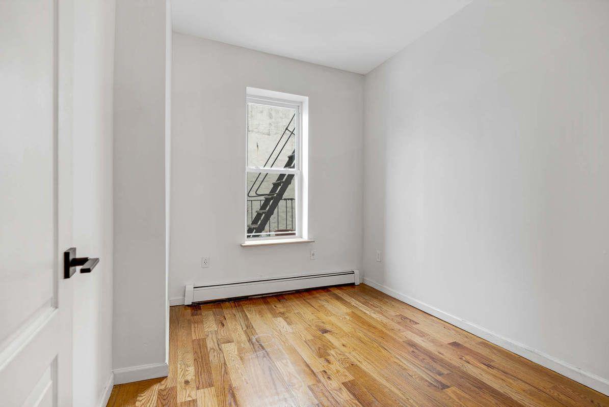 1235 Decatur Street, Unit 2 Brooklyn, NY 11207 - Photo 11 of 13 an empty room with a window