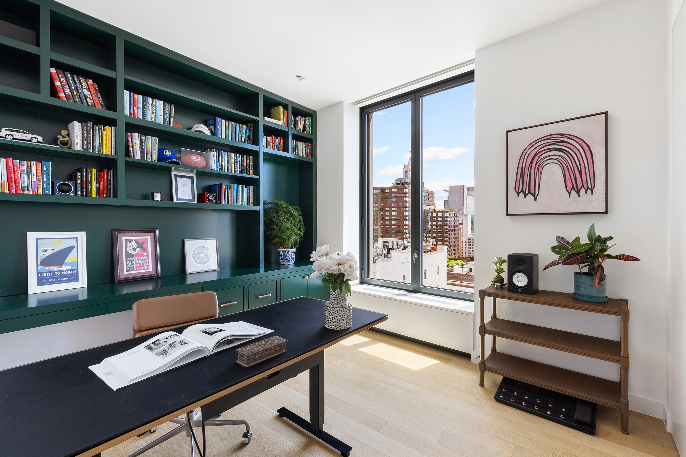 21 East 12th Street, Unit 17B Manhattan, NY 10003 - Photo 10 of 13 a work room with furniture and a book shelf