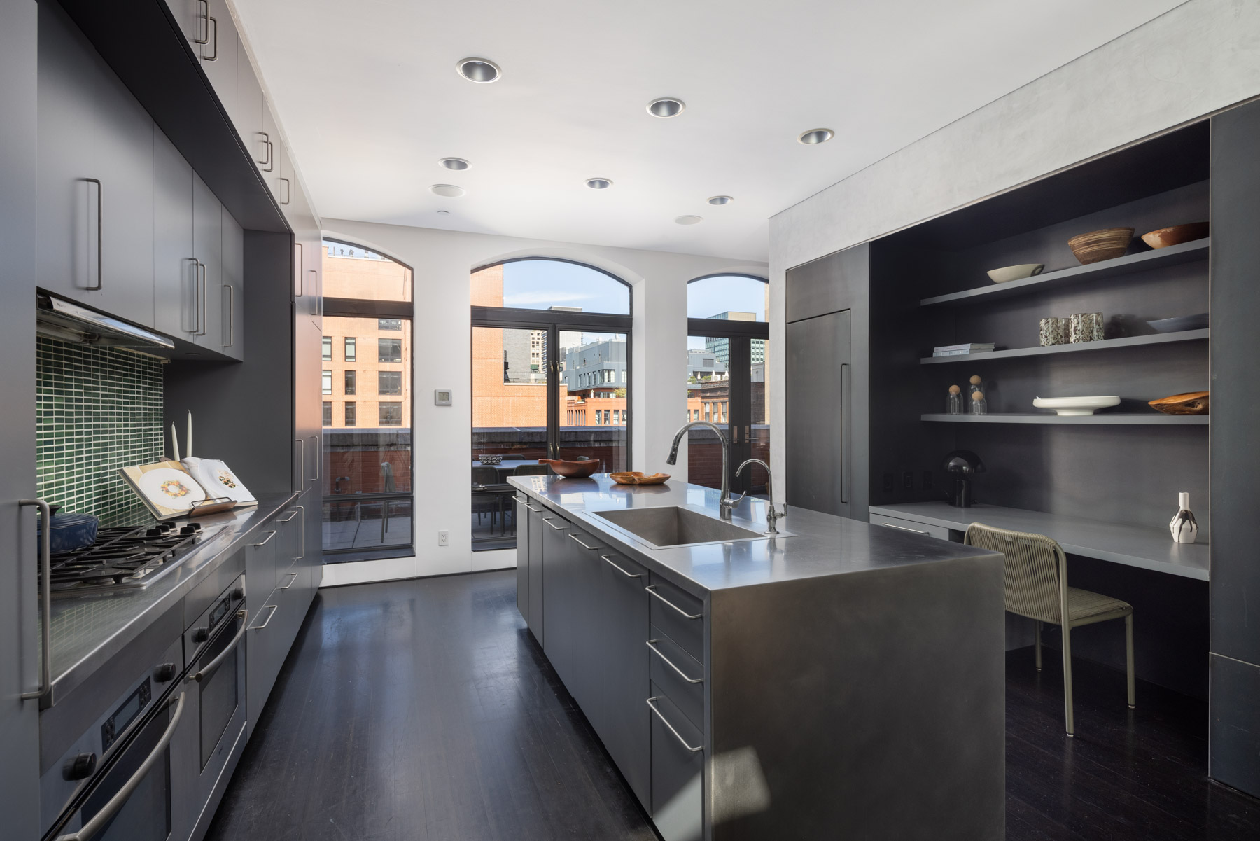 92 Laight Street, Unit PHC Manhattan, NY 10013 - Photo 7 of 16 a kitchen with stainless steel appliances granite countertop a stove and a refrigerator