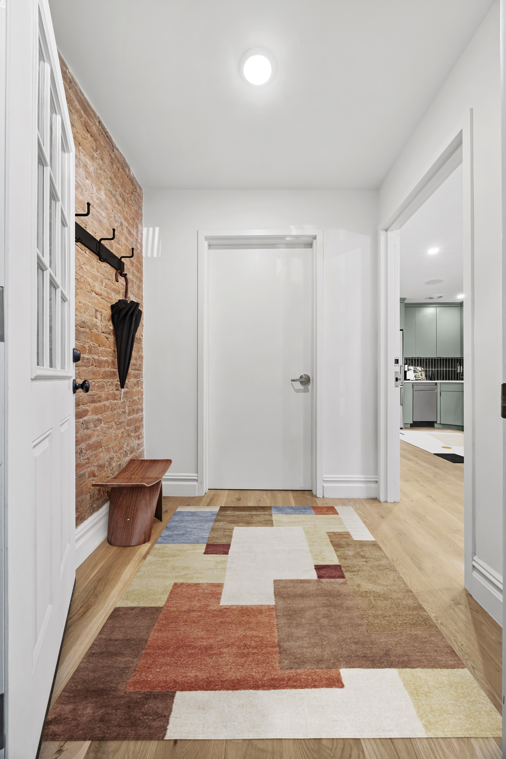 544 Madison Street, Unit A Brooklyn, NY 11221 - Photo 5 of 17 a bathroom with a tub shower and sink