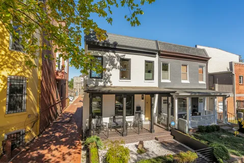 a front view of a house with garden