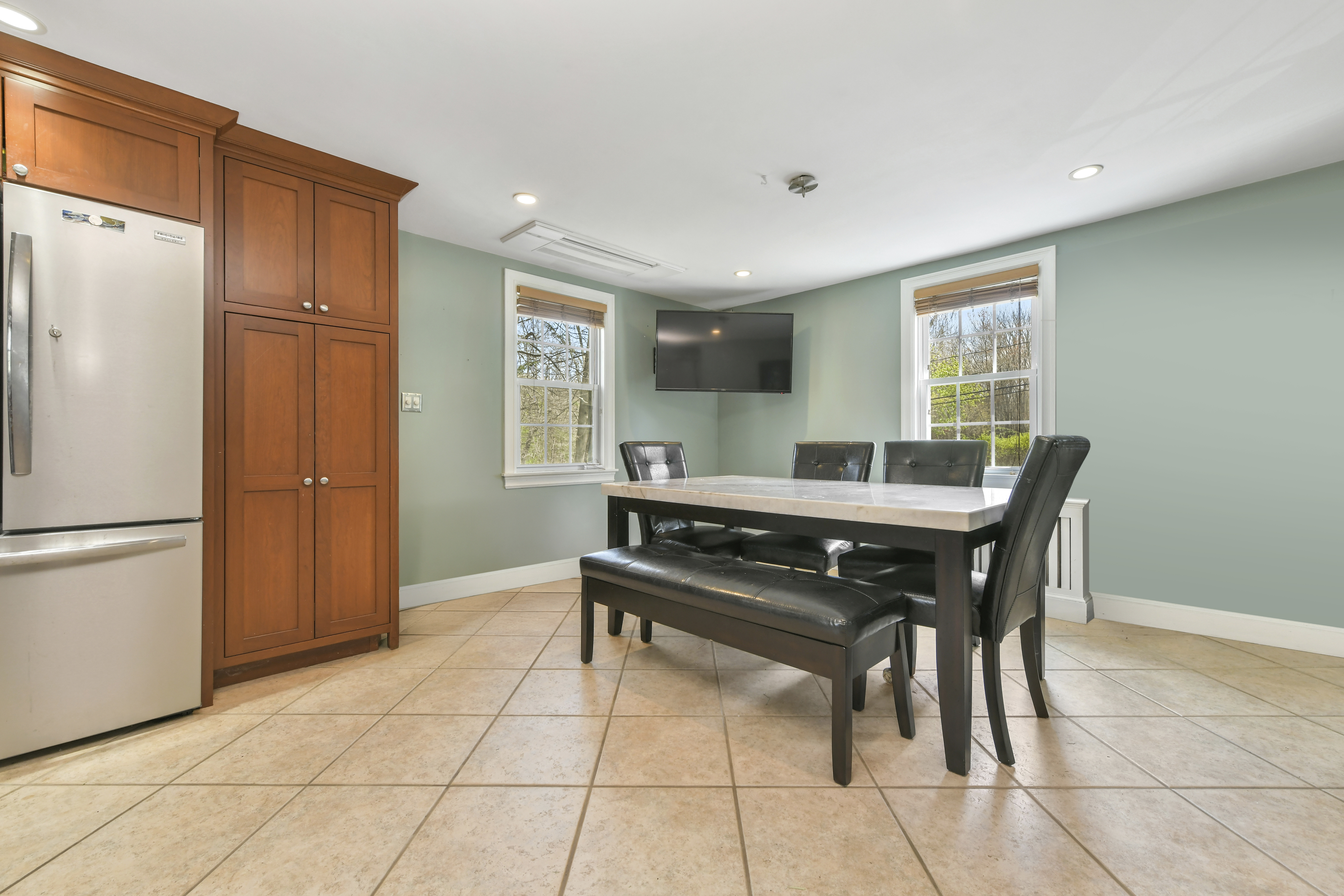 50 Rustic Road Walpole, MA 02032 - Photo 5 of 16 a table and chairs in a room with kitchen view