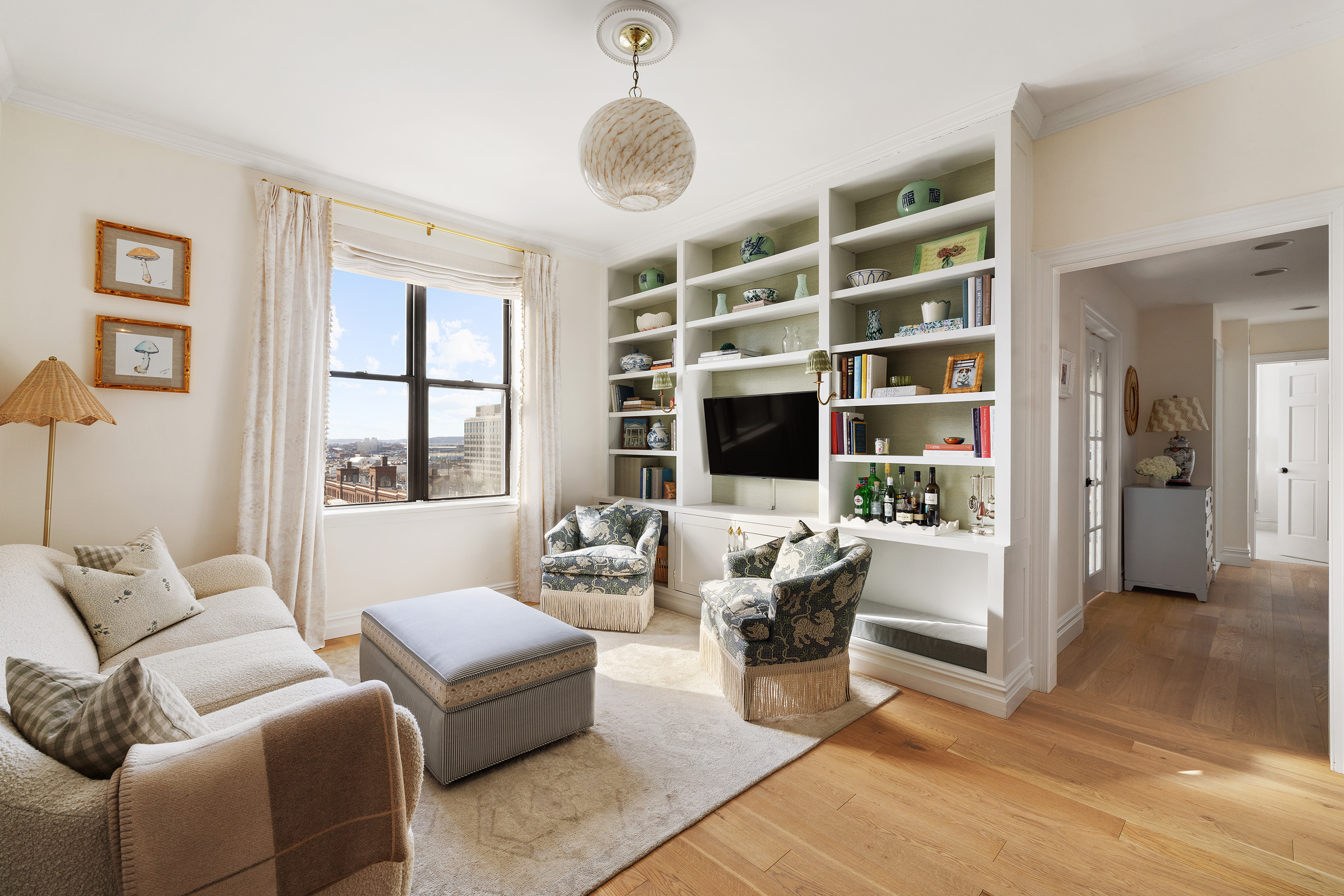 2 Grace Court, Unit 6E Brooklyn, NY 11201 - Photo 1 of 11 a living room with furniture windows and a flat screen tv
