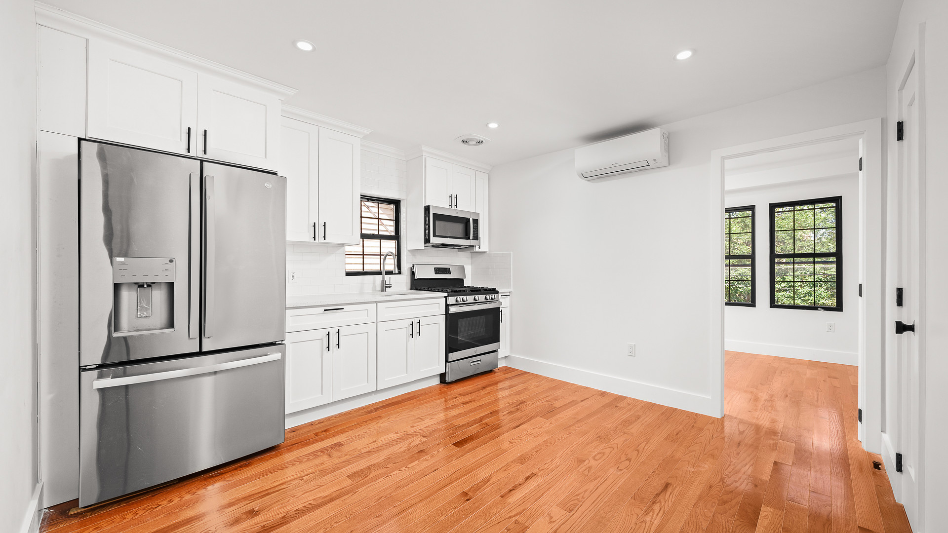 170-10 118th Avenue Queens, NY 11434 - Photo 2 of 7 a kitchen with a refrigerator and a stove top oven