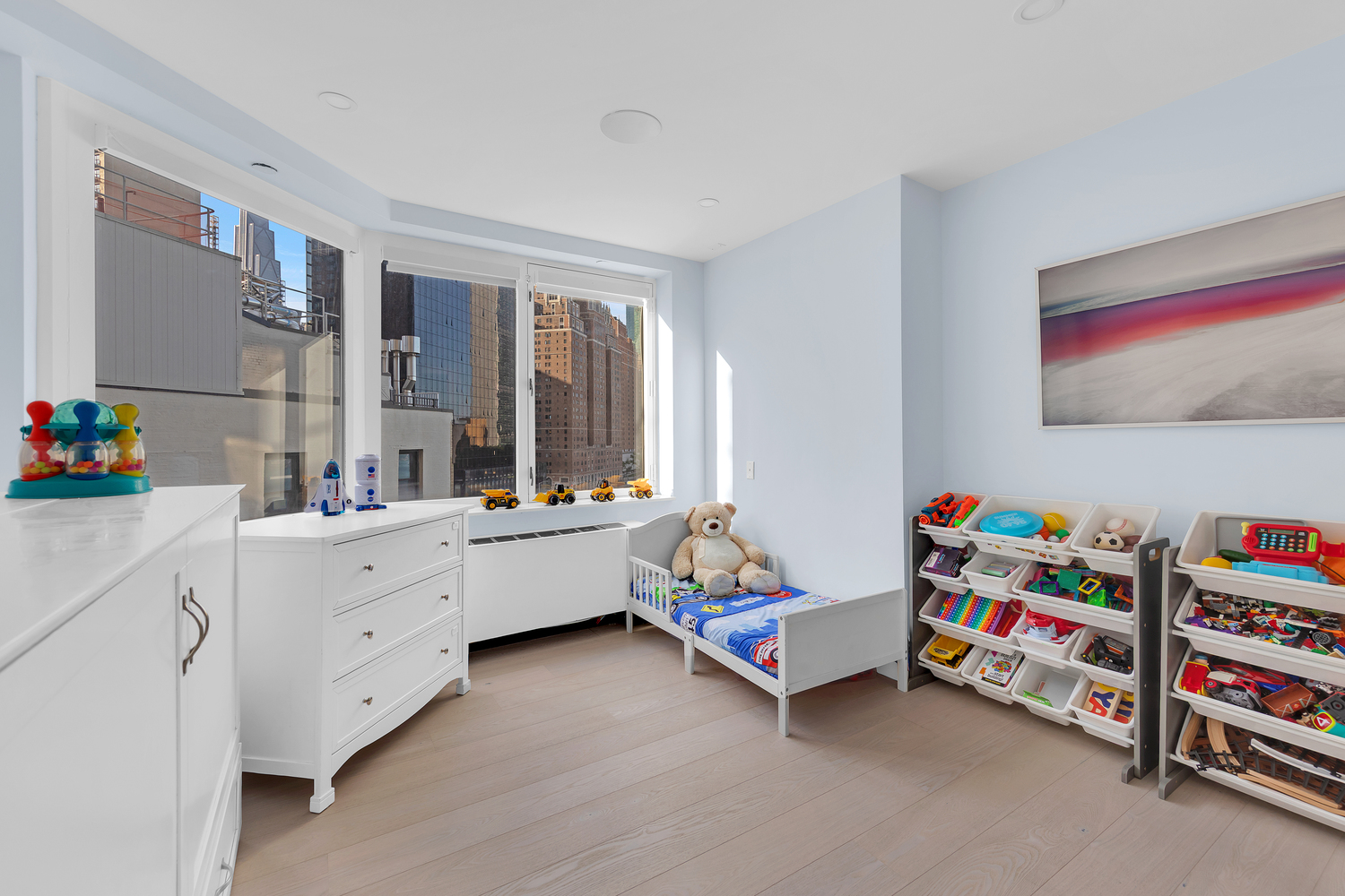 415 East 37th Street, Unit 9JK Manhattan, NY 10016 - Photo 13 of 28 a room with toys and windows