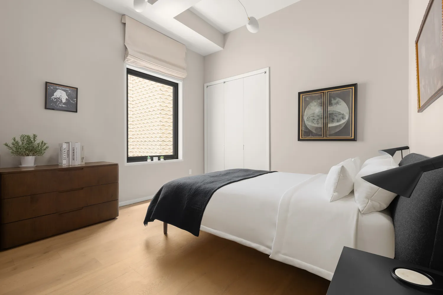 a bedroom with a bed and window