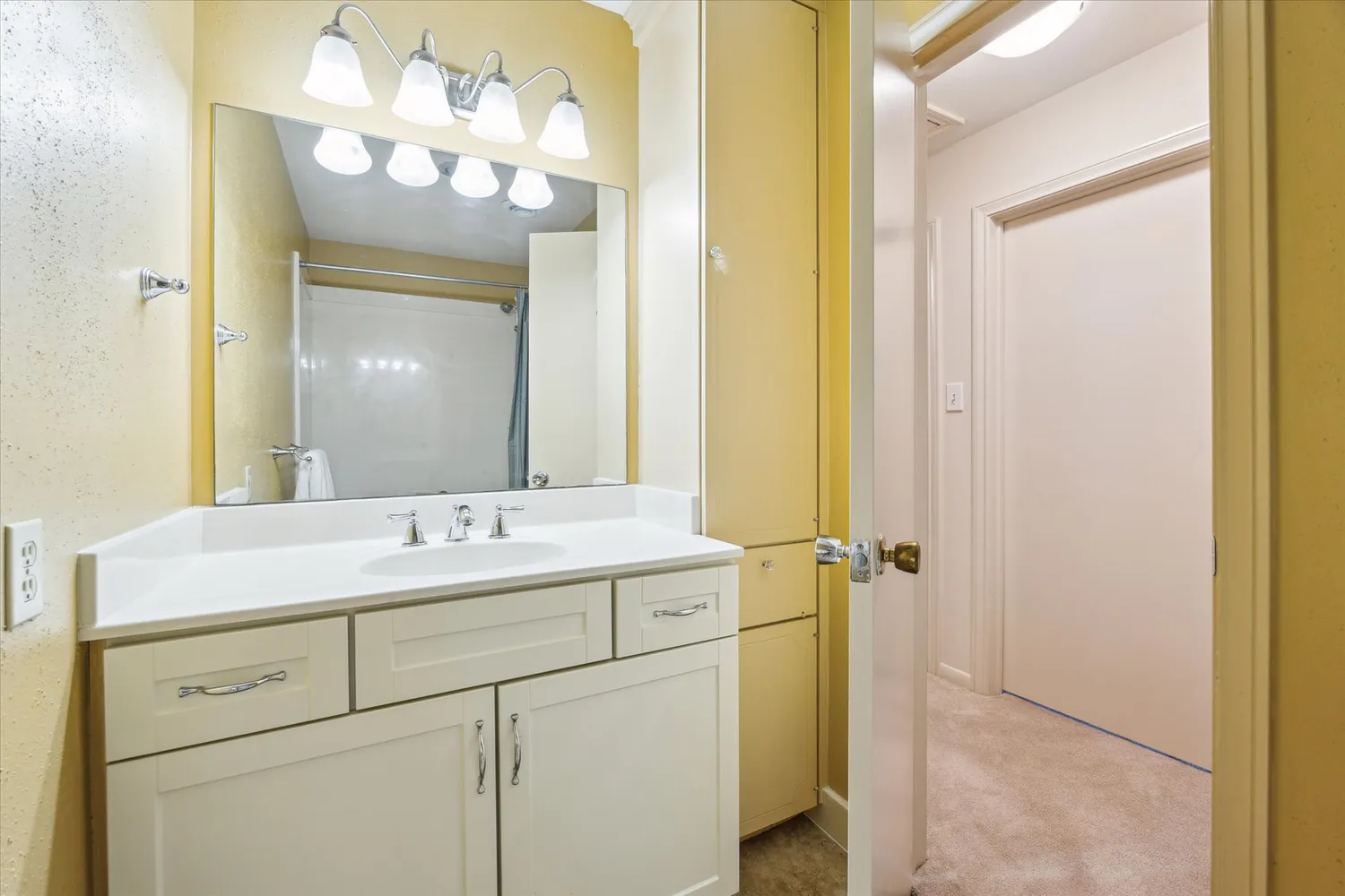 a bathroom with a sink and a mirror