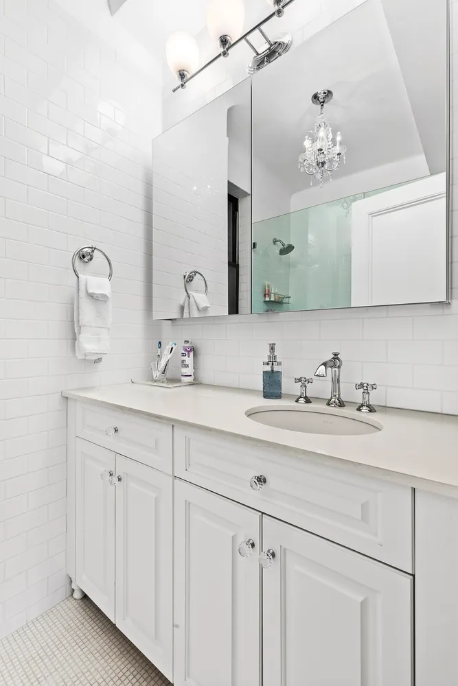 a bathroom with a sink double vanity and a mirror