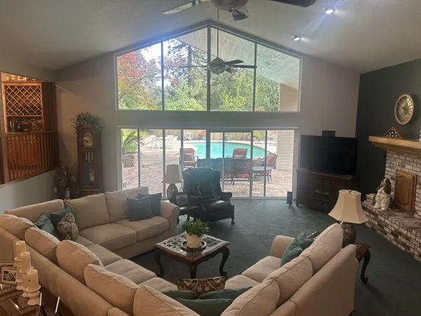 a living room with fireplace and a fireplace