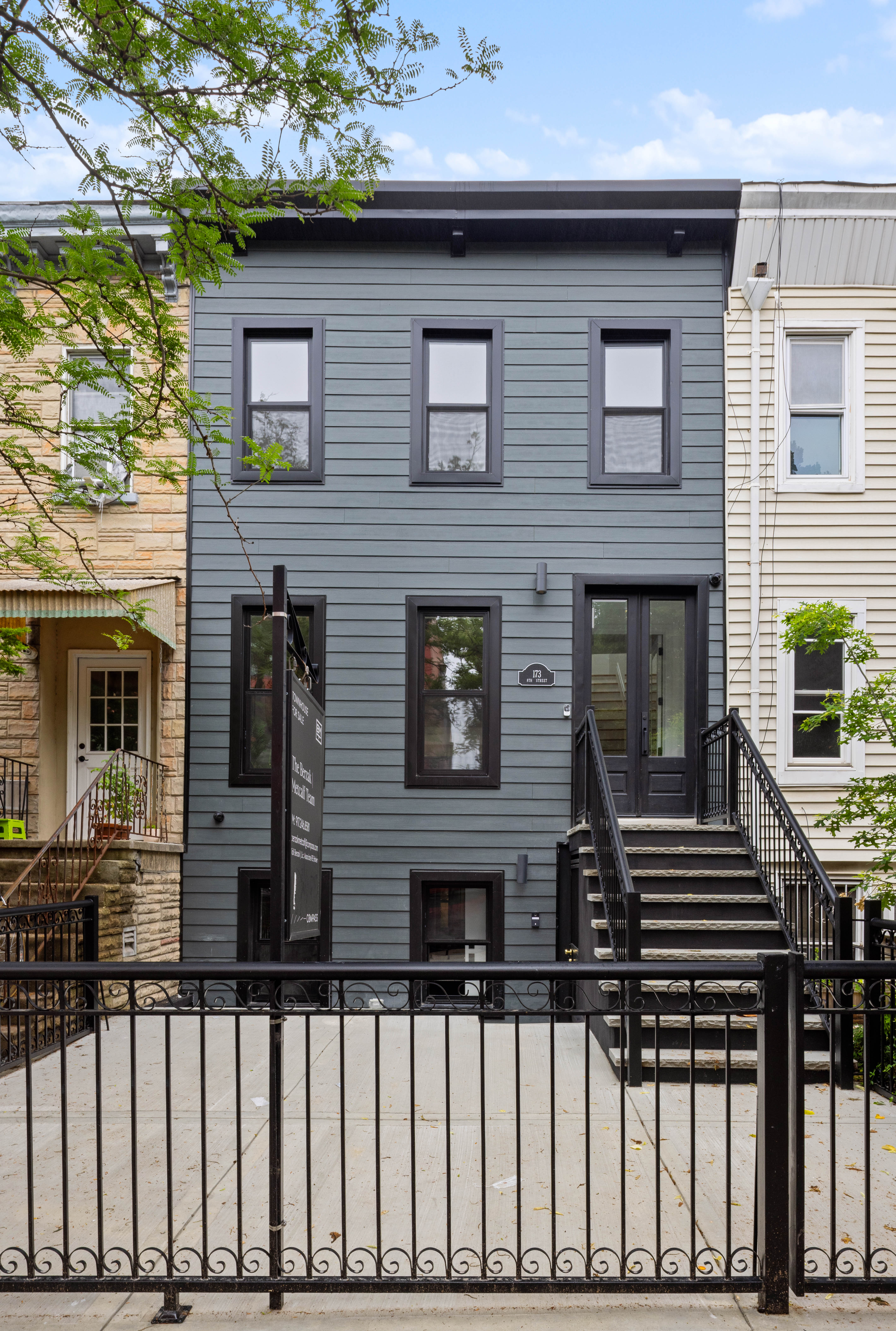 173 8th Street Brooklyn, NY 11215 - Photo 15 of 17 a front view of a house with stairs
