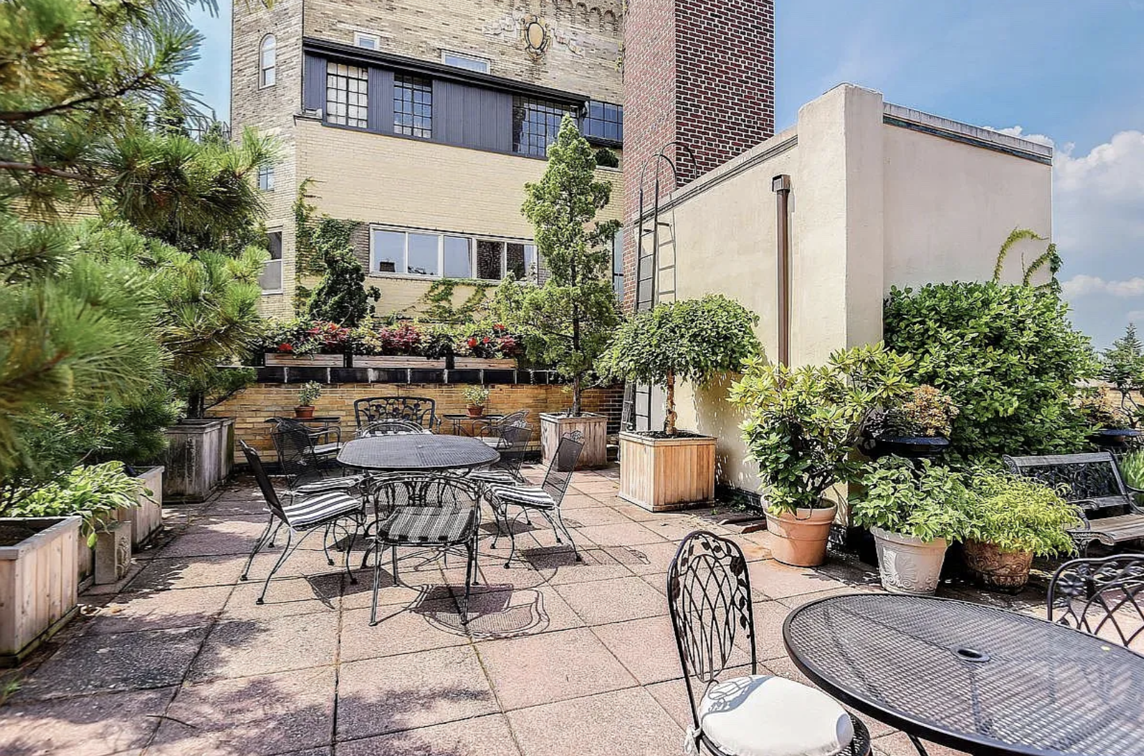 30 5th Avenue, Unit 4F Manhattan, NY 10011 - Photo 13 of 15 a view of a patio with couches table and chairs and potted plants