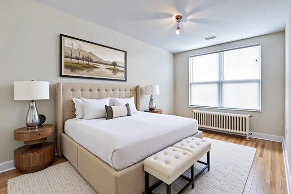 a bedroom with a bed and a table