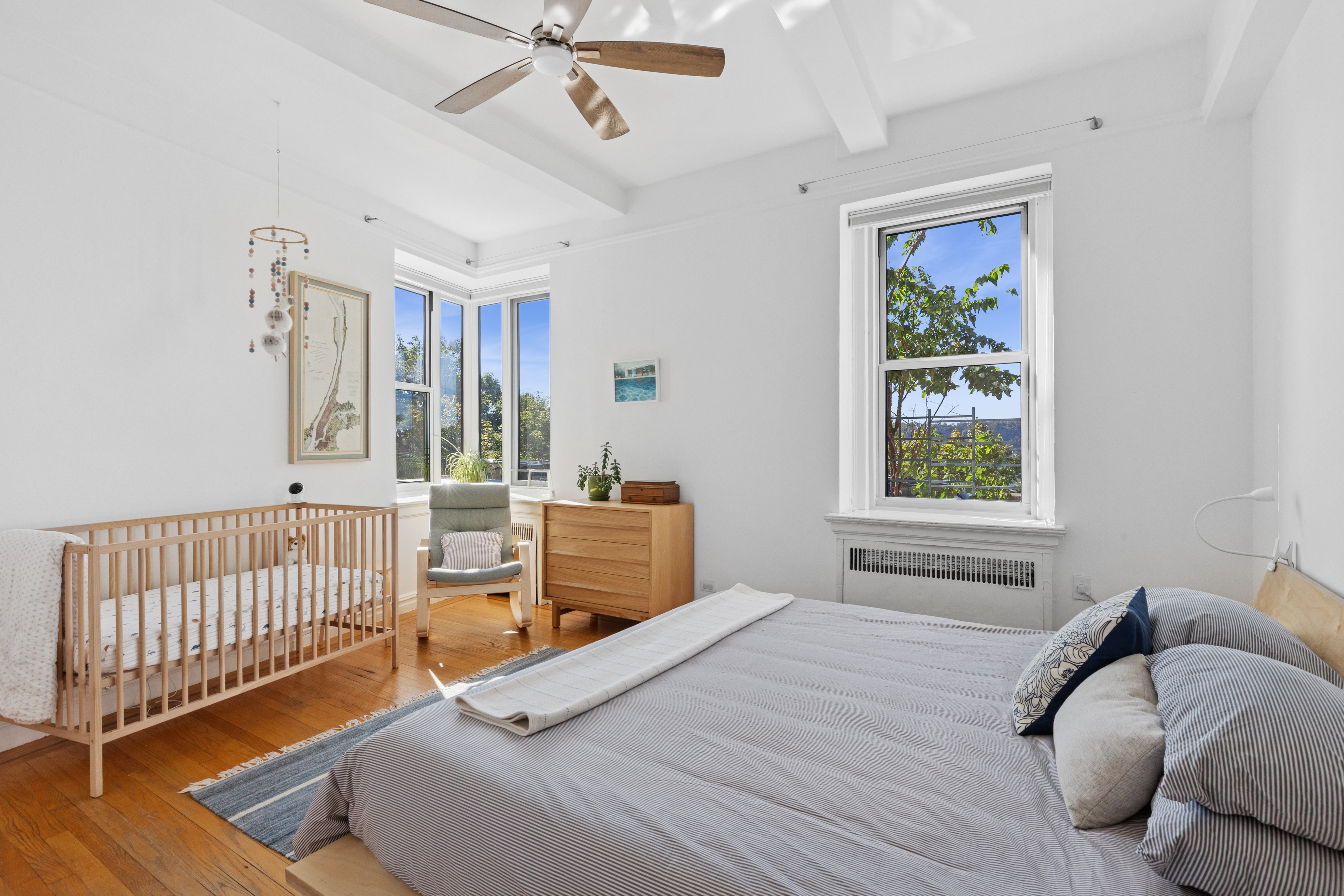 250 Cabrini Boulevard, Unit 1H Manhattan, NY 10033 - Photo 6 of 17 a bedroom with a bed and a window