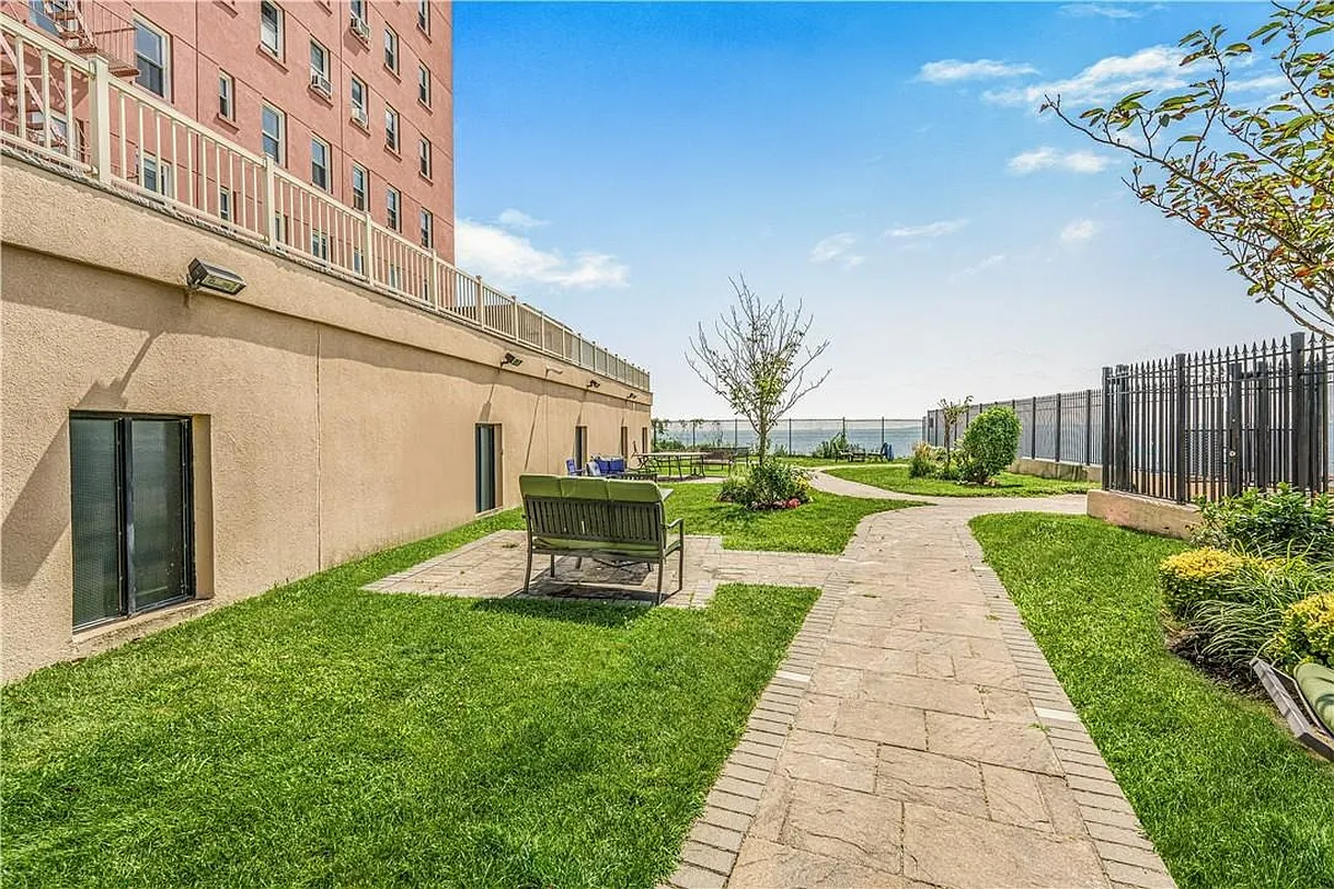 286 Corbin Place, Unit 2A Brooklyn, NY 11235 - Photo 10 of 13 a front view of a building with garden