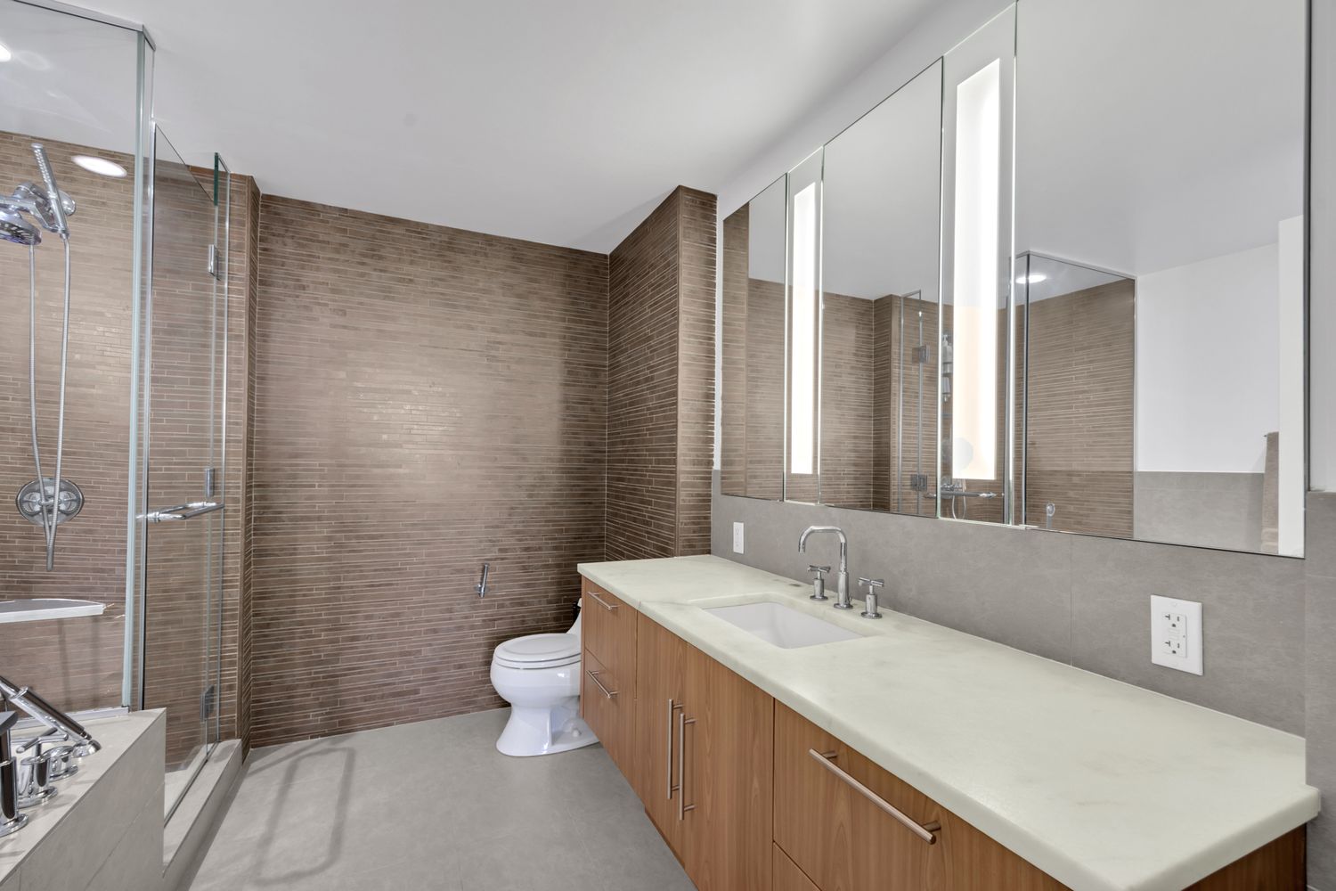 306 Gold Street, Unit 20F Brooklyn, NY 11201 - Photo 11 of 21 a bathroom with a sink a toilet and shower