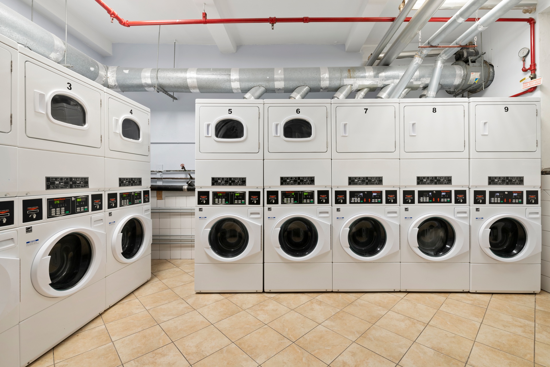 20 West 72nd Street, Unit 1403 Manhattan, NY 10023 - Photo 7 of 8 a utility room with dryer and washer