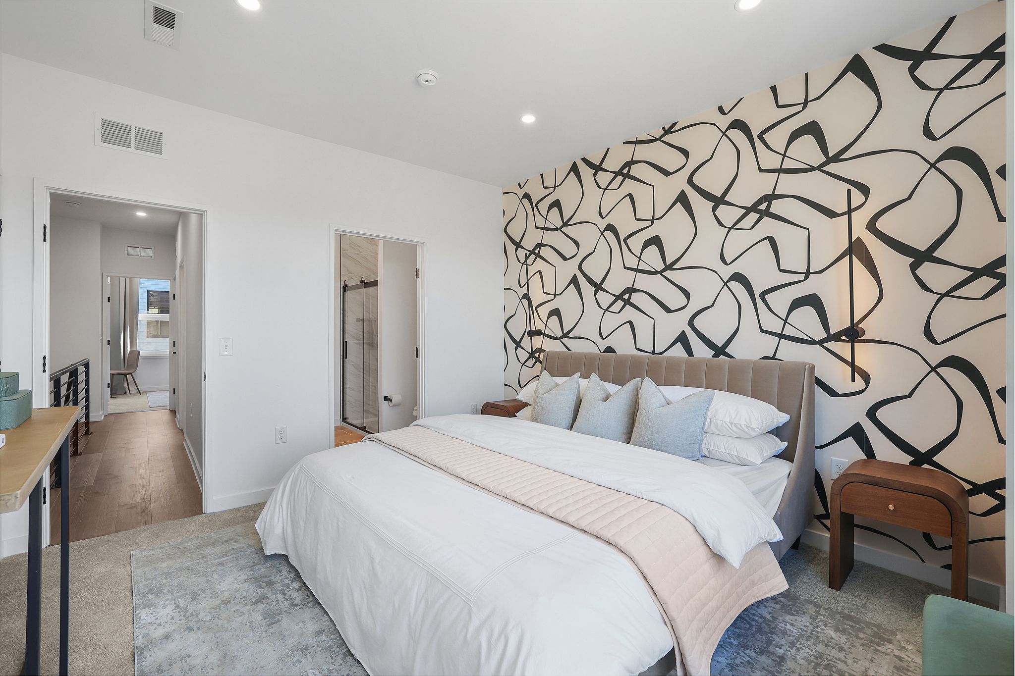 1036 Howard Road Southeast Washington, DC 20020 - Photo 31 of 41 a bedroom with a bed and a couch with wooden floor