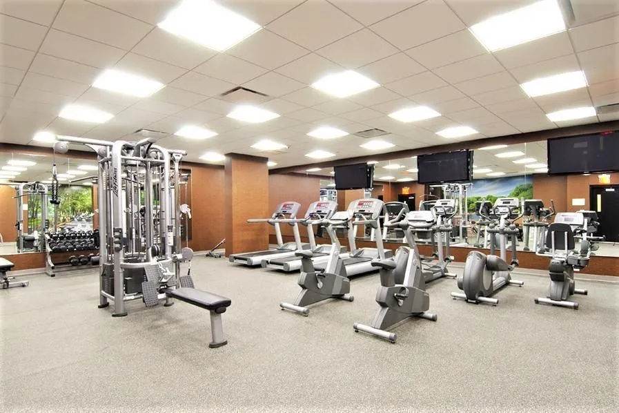 a lobby with furniture and large window