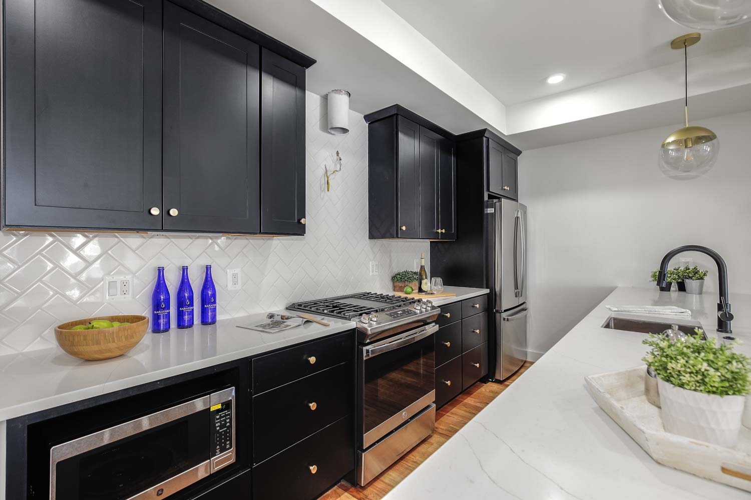428 Manor Place Northwest, Unit 1 Washington, DC 20010 - Photo 9 of 27 a kitchen with stainless steel appliances granite countertop a stove a refrigerator and a stove
