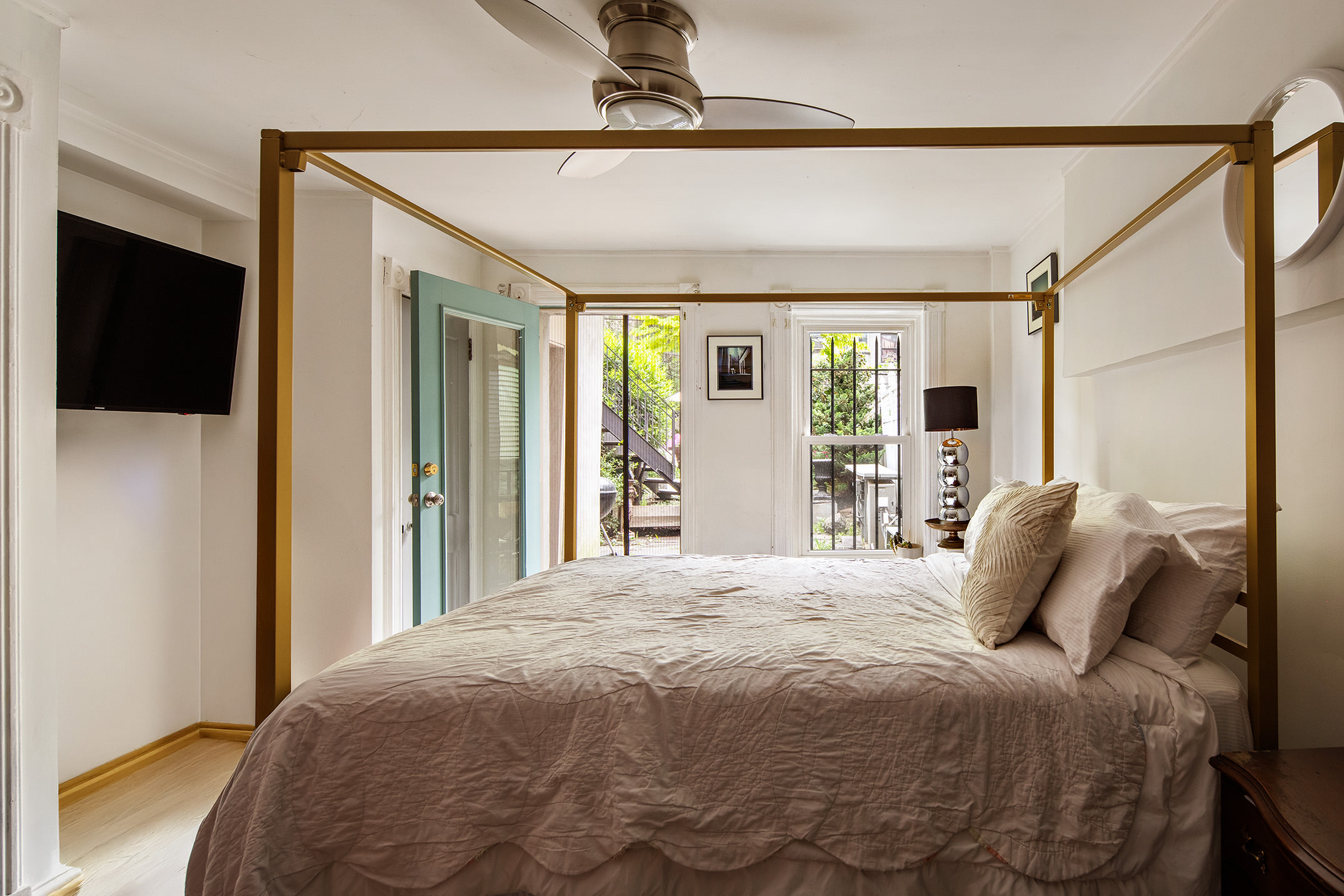 183 Halsey Street Brooklyn, NY 11216 - Photo 20 of 23 a bed sitting in a bedroom next to a window